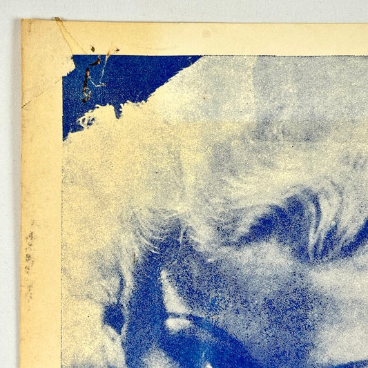 Top left corner with pin holes and tape marks.