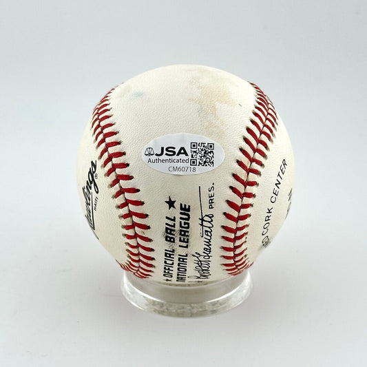 Baseball with JSA authentication label on a white background
