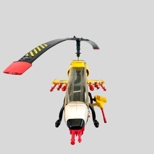 Toy helicopter with red and yellow accents on a light gray background