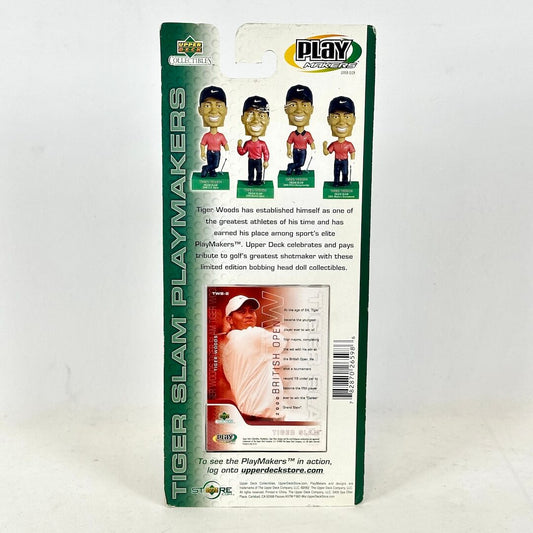 Packaged Tiger Woods bobblehead collectible with branding and product details on a white background