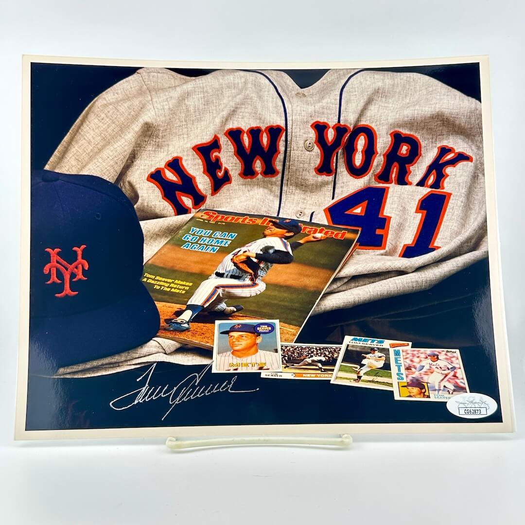 Photograph of memorabilia collage featuring signature of player, JSA authentication sticker in corner.