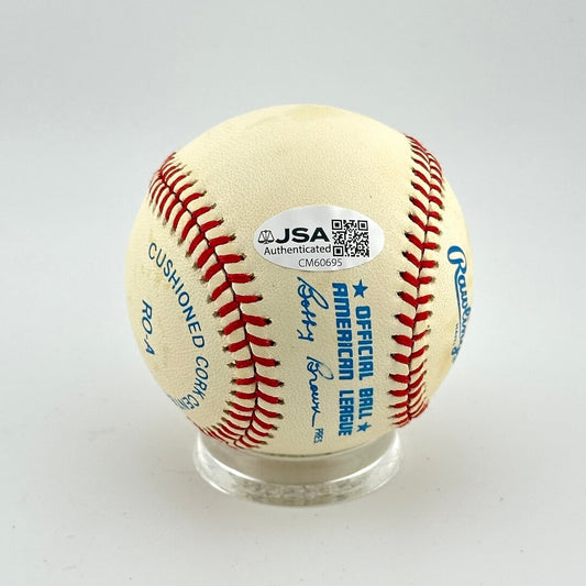 Baseball with JSA authentication label on a white background
