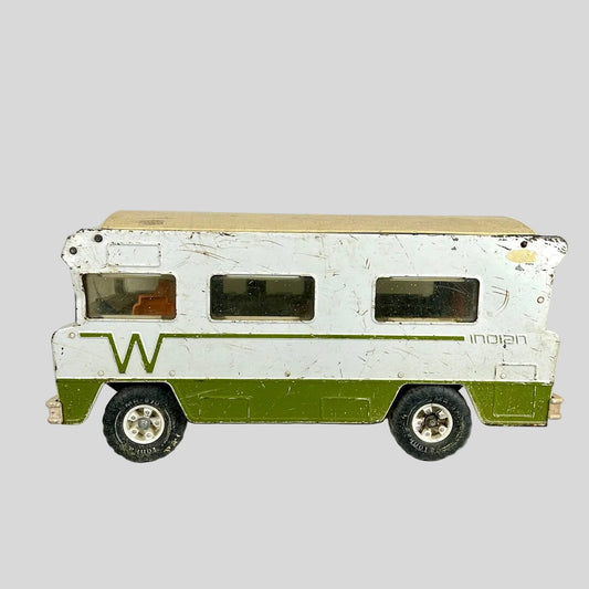 Model of a vintage camper van with a white body and green bottom section on a light gray background