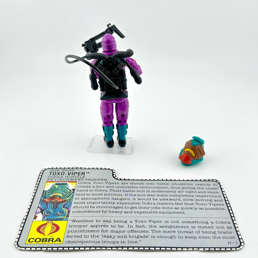 Toy figure of Toxo-Viper with a card detailing its character and background on a white background