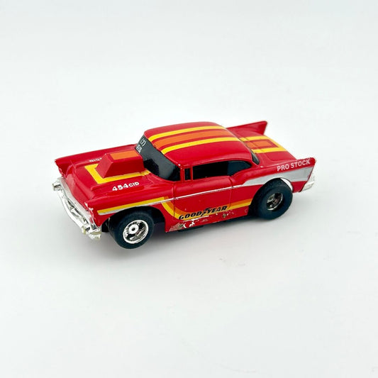 Red and yellow toy car on a white background