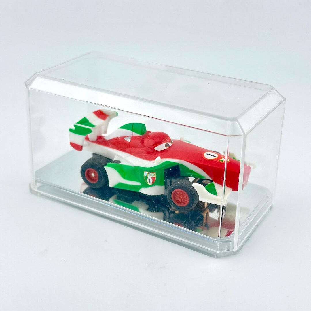 Toy race car in a clear display case on a white background