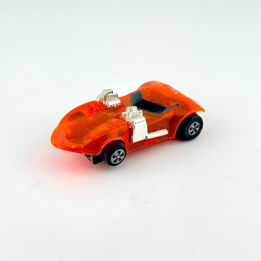 Orange toy car with a transparent body on a white background