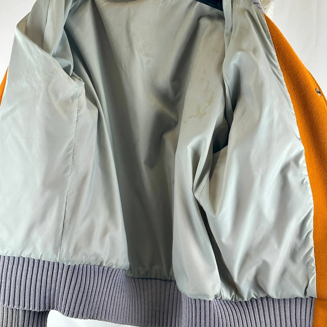 Interior of jacket to show stain placements but otherwise good condition.