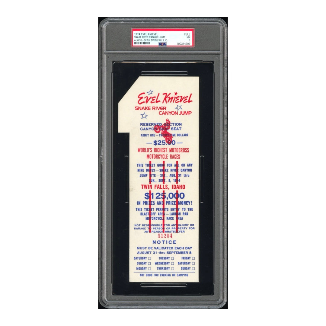 Evel Knievel white graded ticket encapsulated in plastic. The ticket is cut out like a number one with red & blue text.