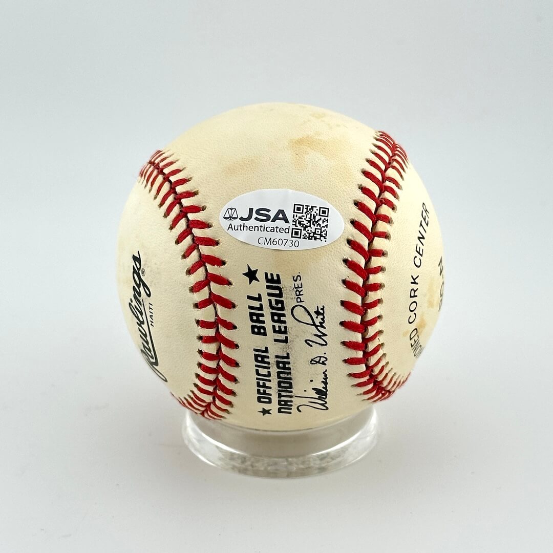 Baseball with JSA Authenticator label on a white background