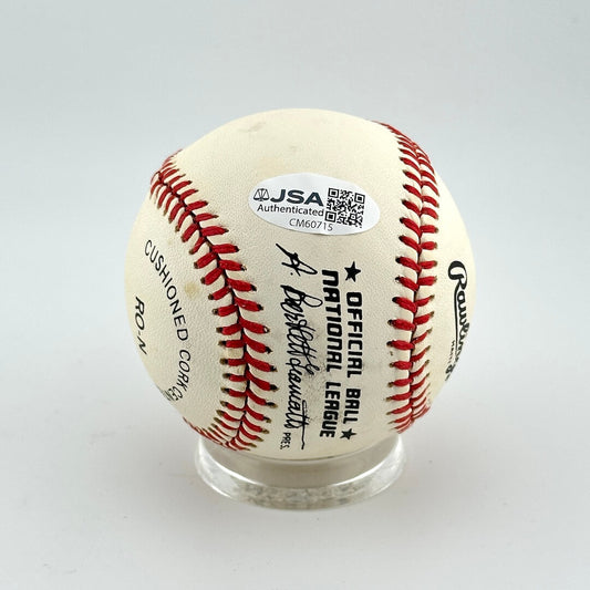 Baseball with a JSA Authentication label on a white background