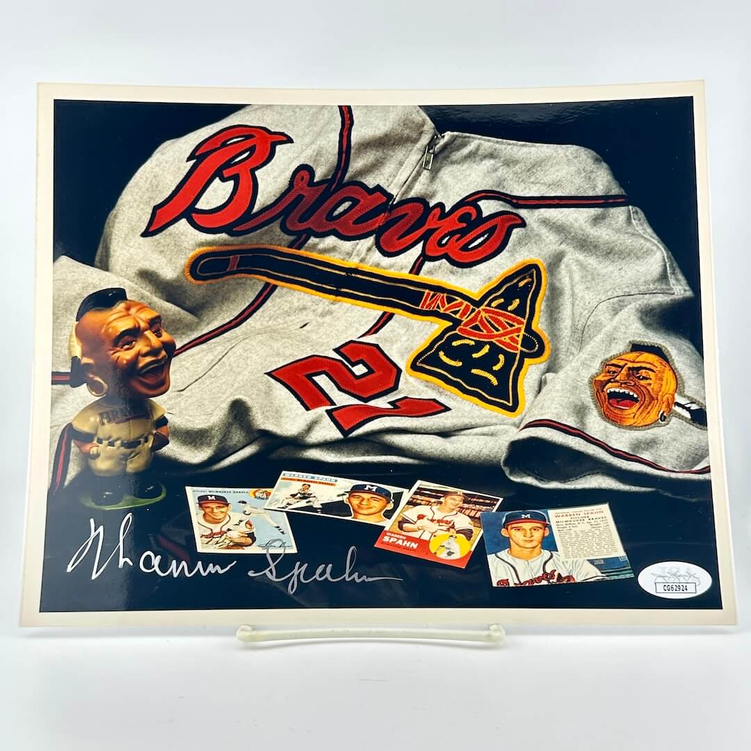Photograph of memorabilia collage featuring signature of player, JSA authentication sticker in corner.
