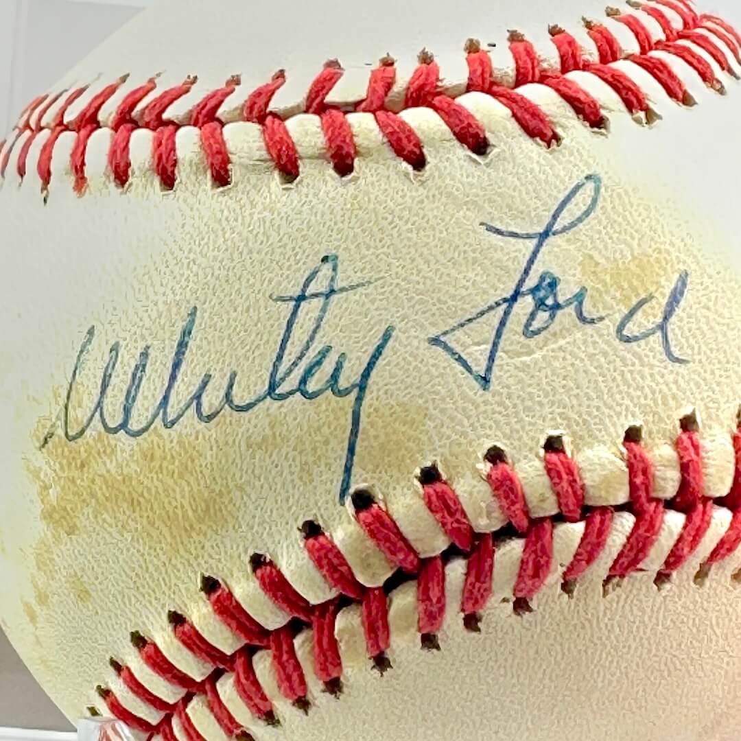 Close up of blue pen signature across sweet spot.