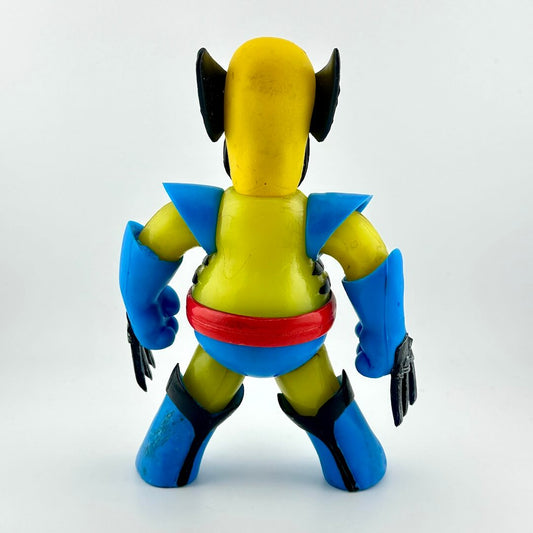 Toy figure with yellow, blue, and red colors on a white background