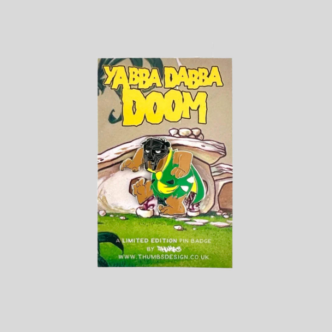 Fred Flintstone in creeping action pose, wearing green & yellow, wearing MF DOOM mask.