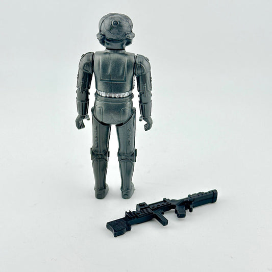 Toy figure of a robot with a weapon on a white background