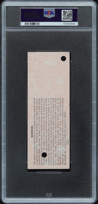 Plastic encased concert ticket with barcode and QR code on banner at top. 