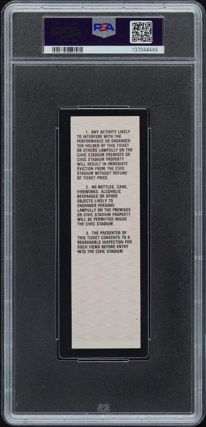 Backside of plastic encased event ticket with barcode and QR code on banner at top. 