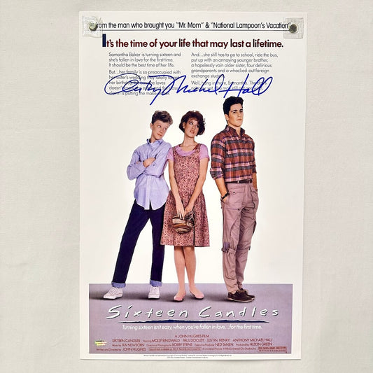 Movie poster for 'Sixteen Candles' featuring three people standing together with a signature at the top.