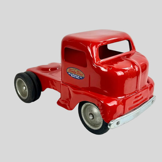 Red toy truck with a visible brand logo on a white background