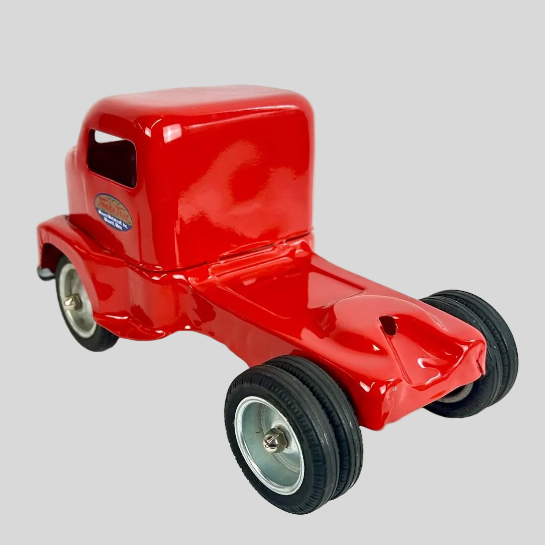 Red toy truck on a white background
