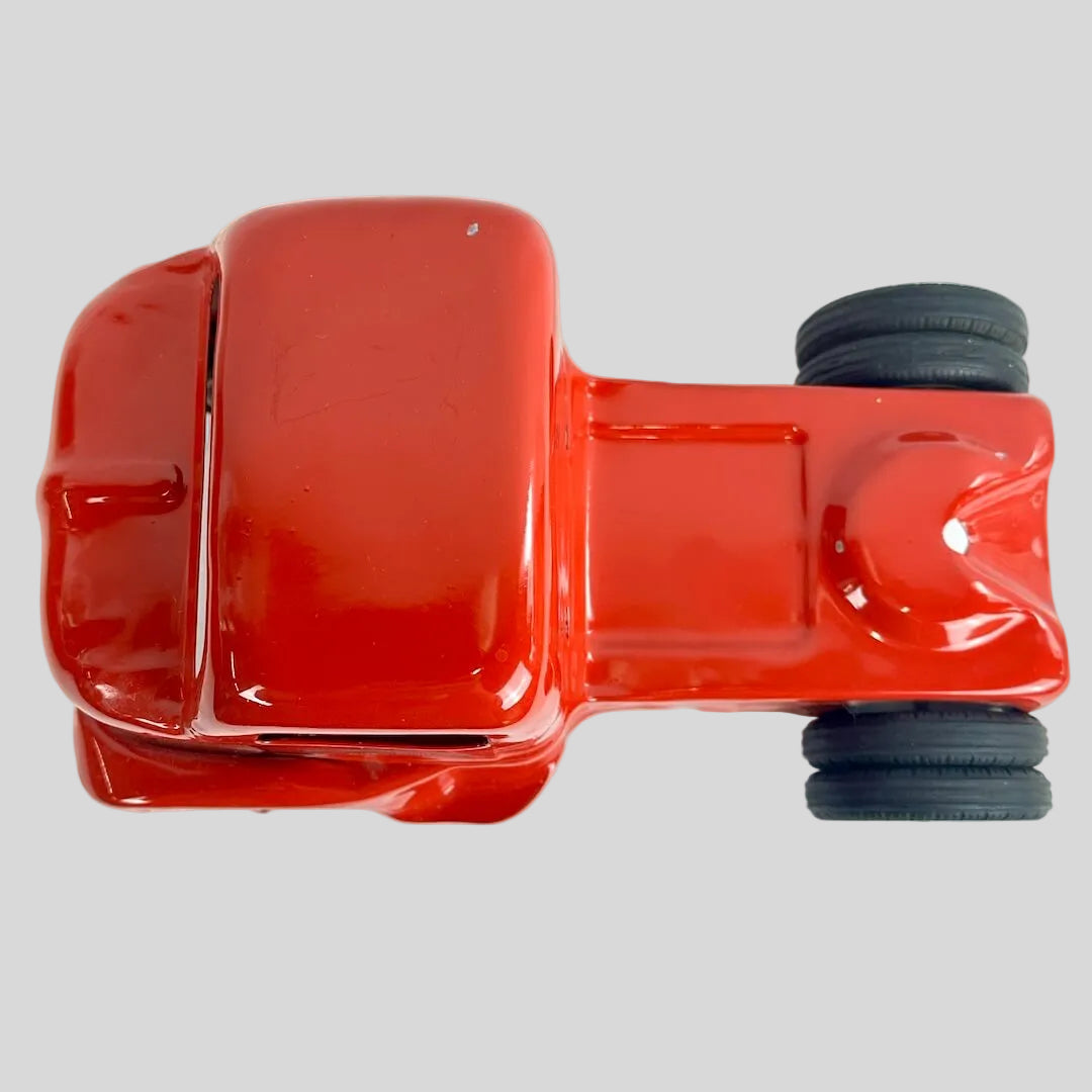 Red toy truck on a gray background