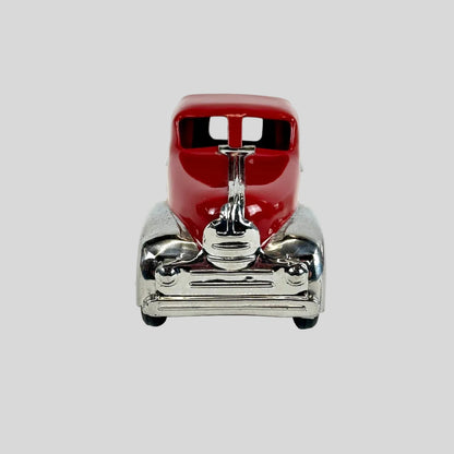 Model of a red car with a silver body on a white background