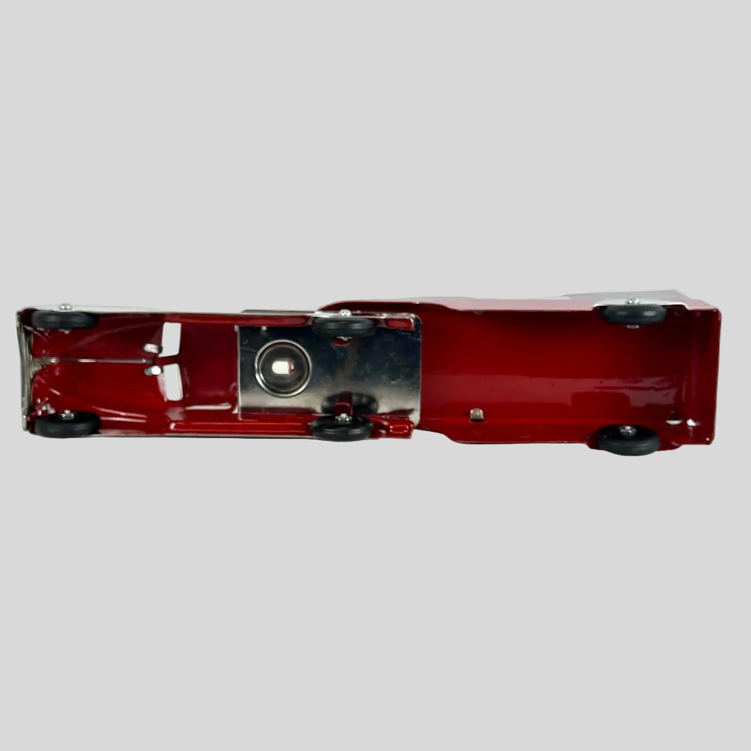 Red toy truck on a white background