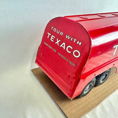 Red toy truck with 'Tour with Texaco' text on a white background
