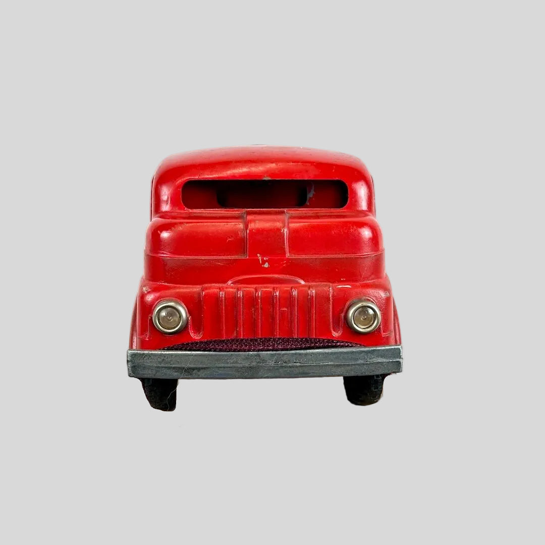 Red toy truck on a white background
