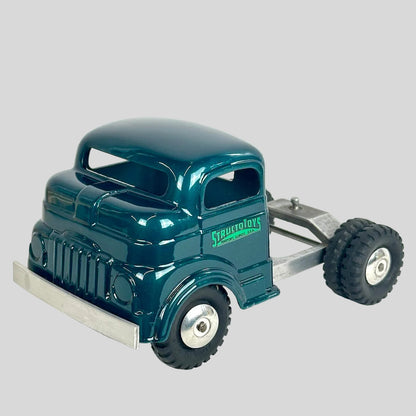 Green toy truck with a trailer on a white background