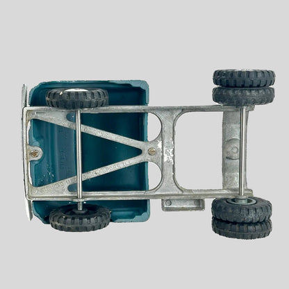 Underside of toy truck with steel body. 