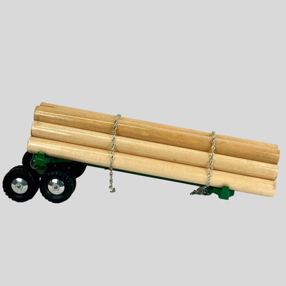 Model truck with wooden logs on a white background