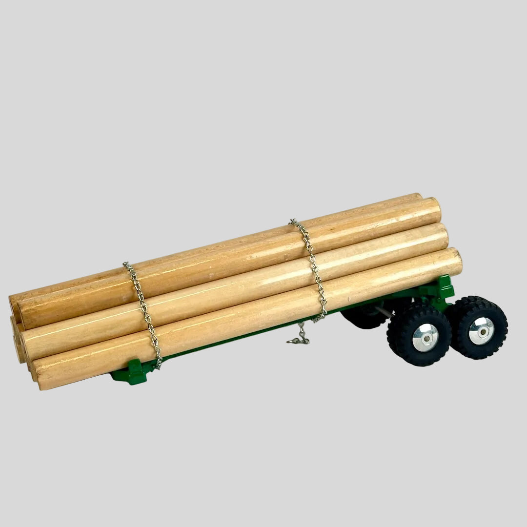 Model of a trailer with wooden logs on a white background
