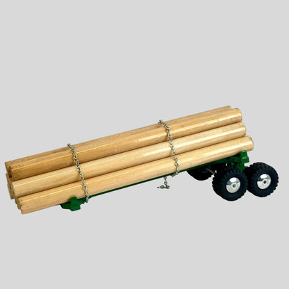 Model of a trailer with wooden logs on a white background