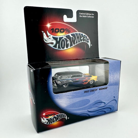 A Hot Wheels 1957 Chevy Nomad diecast toy car in its original packaging, featuring a black car with orange and yellow flames.