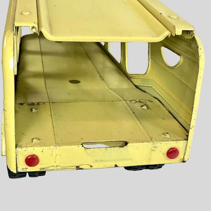 Yellow toy truck with open bed on a white background