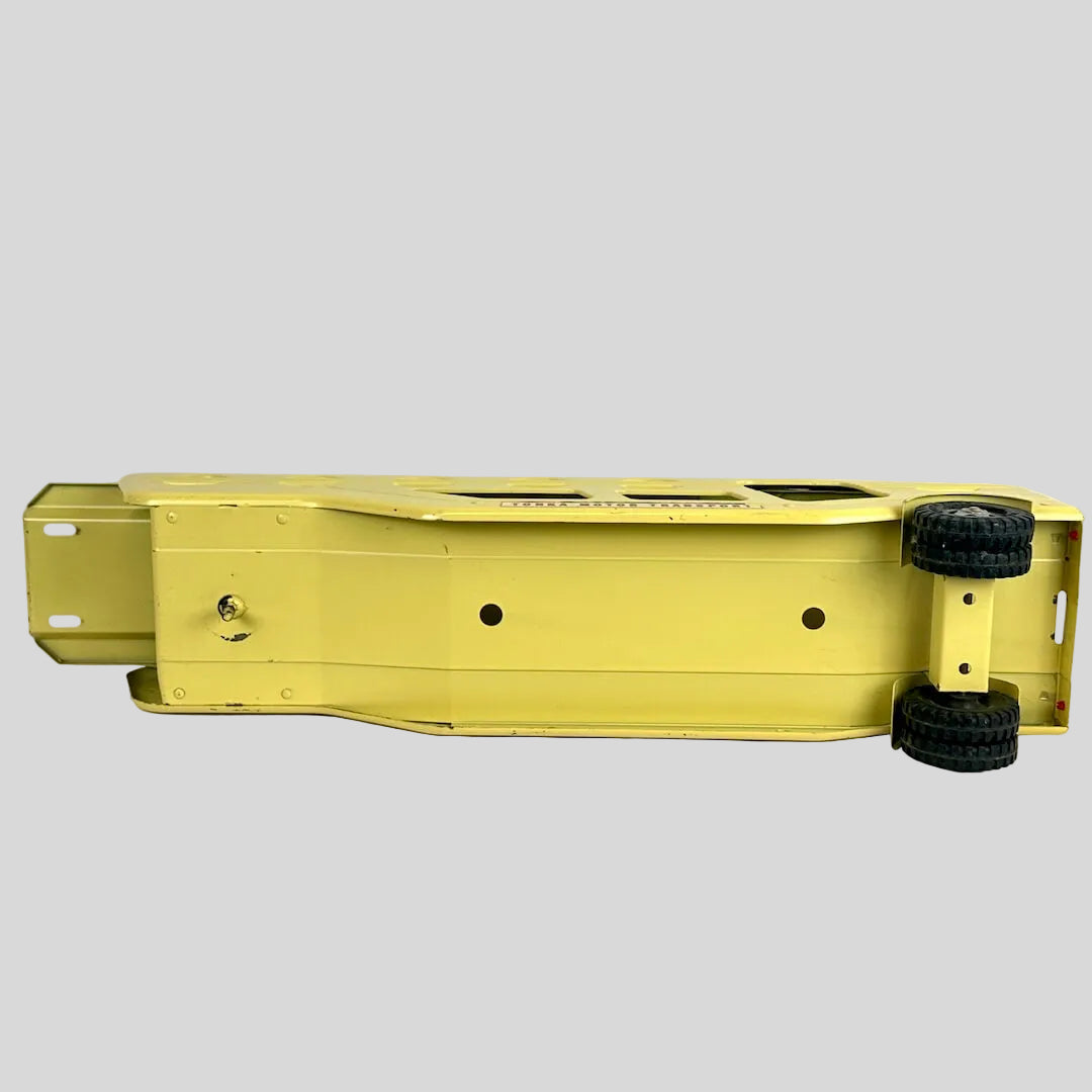 Yellow metal trailer with wheels on a white background