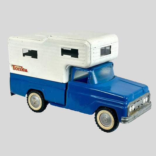 Toy truck with camper shell on a gray background, featuring the Tonka brand.