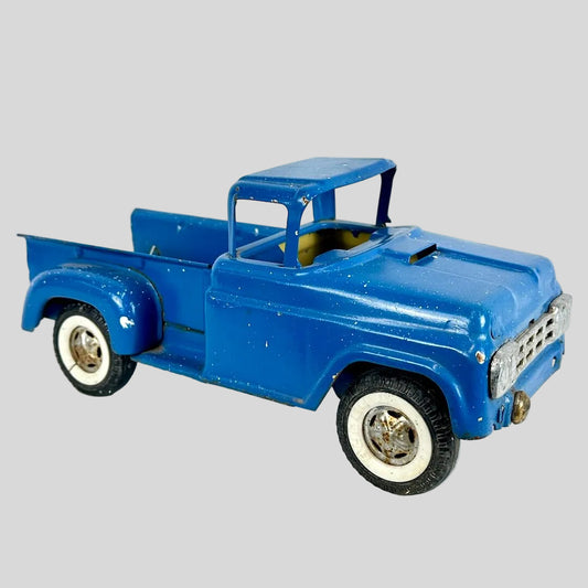 Blue model truck on a light gray background