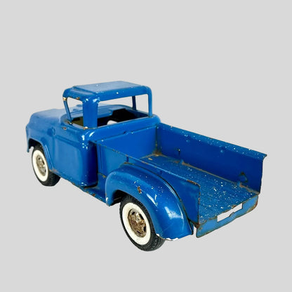 Model of a blue vintage truck on a white background