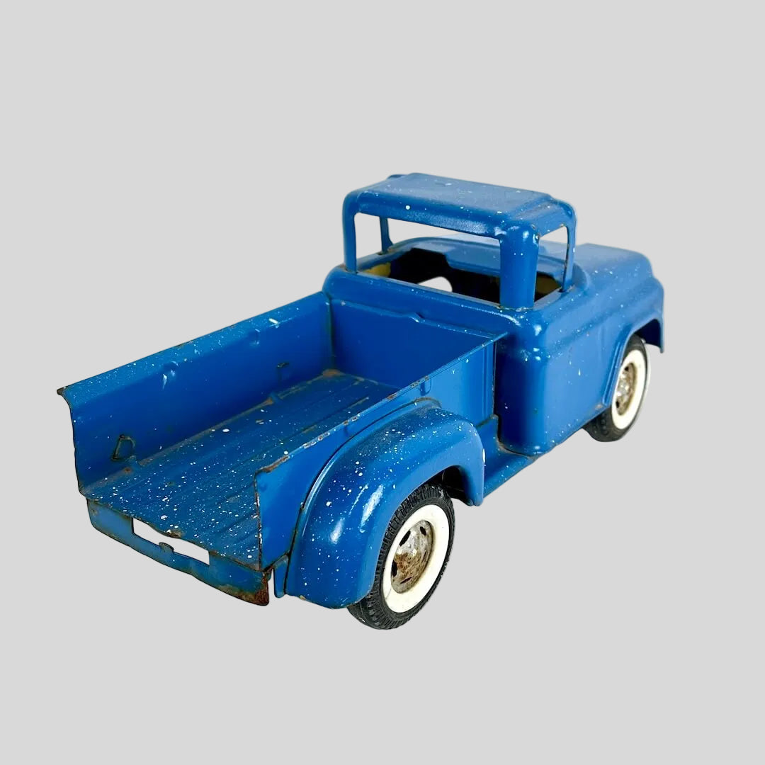 Blue toy truck on a white background
