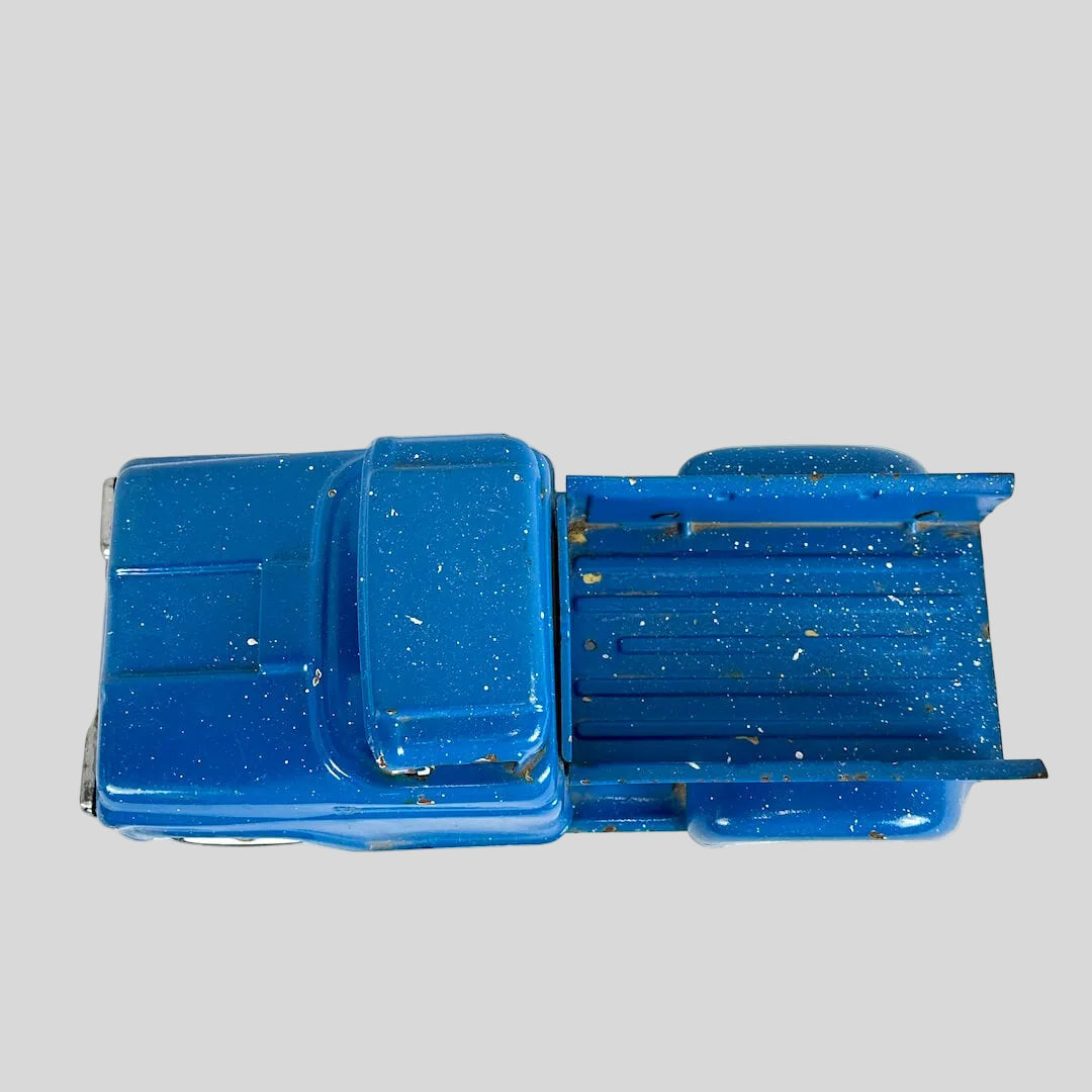 Blue toy truck on a white background