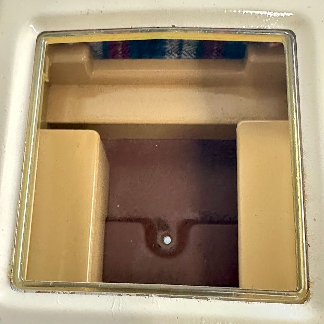 Interior of camper as seen from opening on top. 