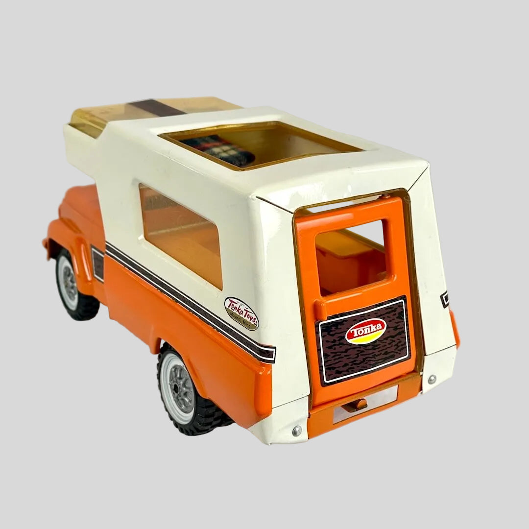 Toy truck with a camper top on a white background