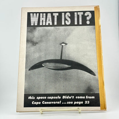 Vintage magazine cover with a space capsule illustration and text on a white background