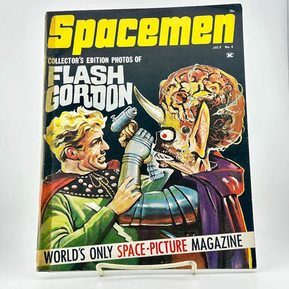 Vintage magazine cover featuring 'Flash Gordon' with a spaceman and alien on a white background