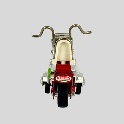 Toy motorcycle with 'Tonka' branding on a white background