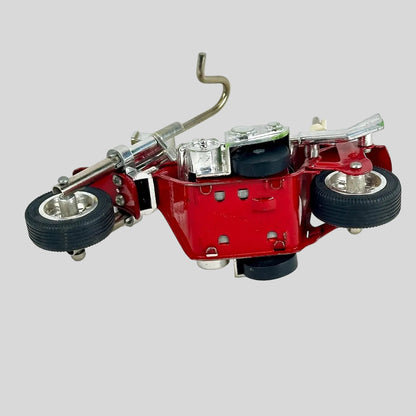 Red mechanical model motorcycle on a white background