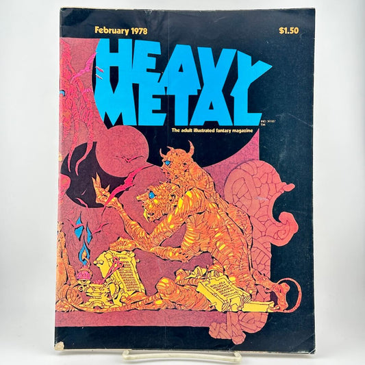Heavy Metal magazine featuring a dark cover with large blue title & orange & pink fantasy illustration of a horned creature.